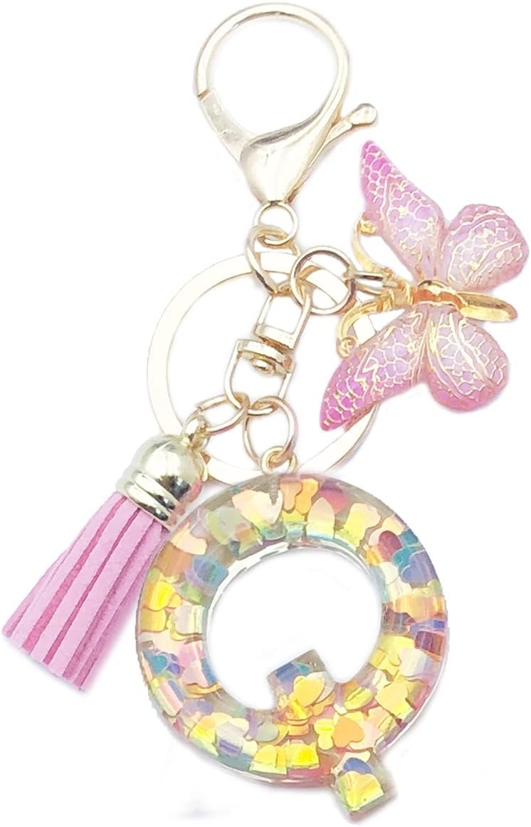 Keychain with letter 'Q' charm, tassel, and butterfly